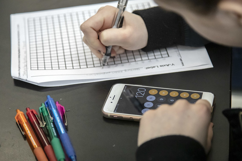 student uses calculator