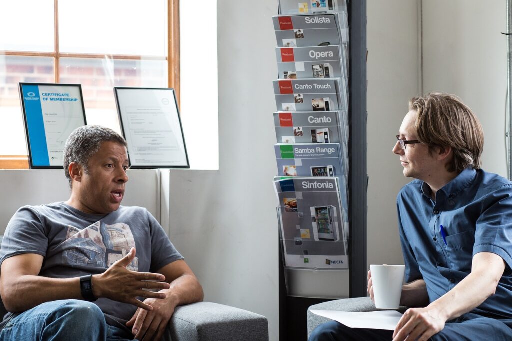 Two people talking in an office